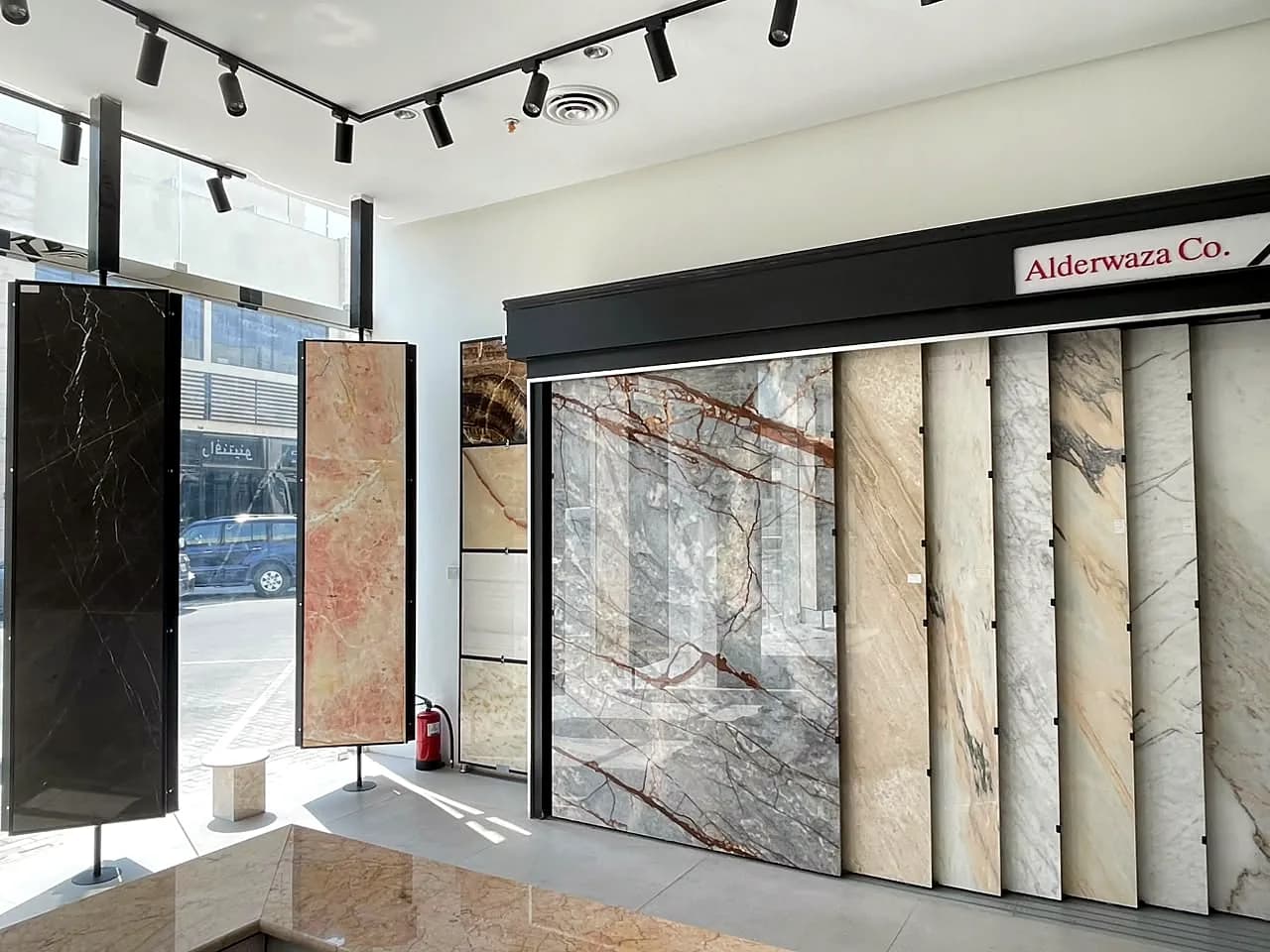 Full polished marble slabs on display inside the Alderwaza showroom