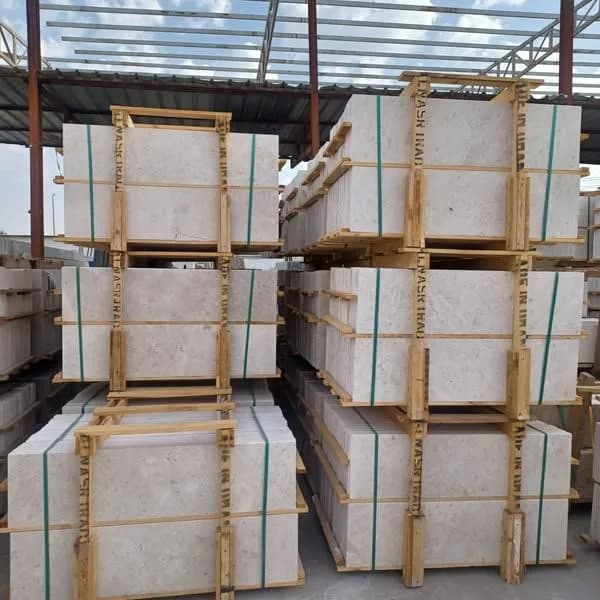 Omani marble staircase steps packed in wooden frames at the stone yard